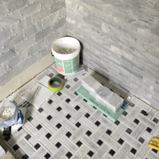 Custom shower with stacked stone tile walls and mosaic tile floor in Cary NC home (1)